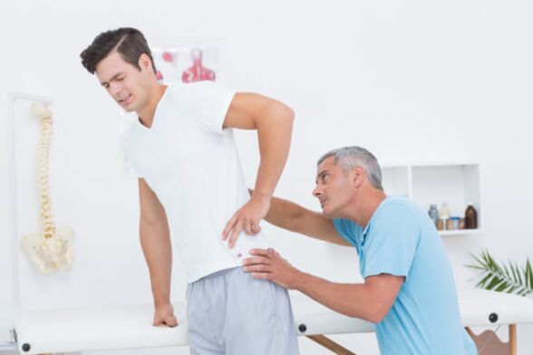 examination by a doctor for low back pain