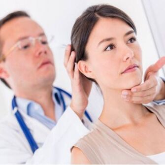 A neurologist examines a patient who has a sore neck